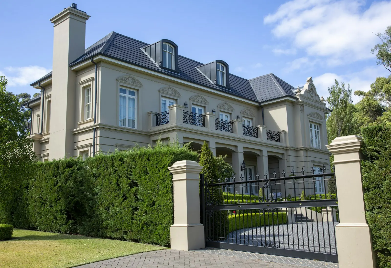 A large two-storey home behind gates